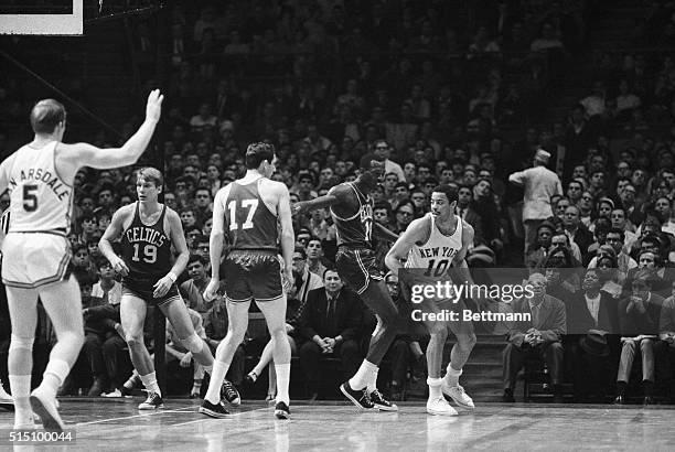 Madison Square Garden: Walt Frazier , of the Knicks is shown dribbling during their game with the Boston Celtics.