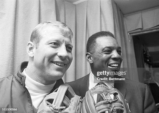 Two great fielder-sluggers, Mickey Mantle of the New York Yankees and Willie Mays of the San Francisco Giants, display a couple of mitts at the...