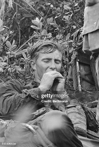 Tam Ky, South Vietnam: Just four of the infinite reactions to war can be seen on the faces of these members of Co. B, 5th Bn., 7th Regiment of the...