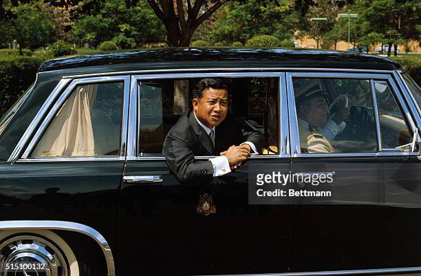 Cambodian Chief of State Prince Norodom Sihanouk leans out limousine window as he leaves Khemarin Palace, November 7th, after Mrs. John F. Kennedy...