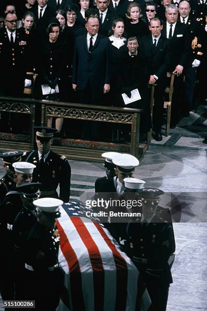 Servicemen representing all military branches carry casket of former President General Dwight D. Eisenhower at final services, 3/31, in the...