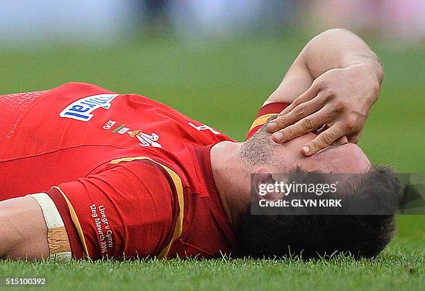 Wales' captain and flanker Sam Warburton picks up an injury during the Six Nations international rugby union match between England and Wales at...