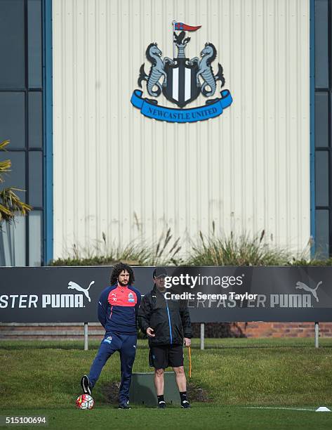 Newcastle Manager Rafael Benitez stands on the sidelines with Captain Fabricio Coloccini during the Newcastle United training session at The...