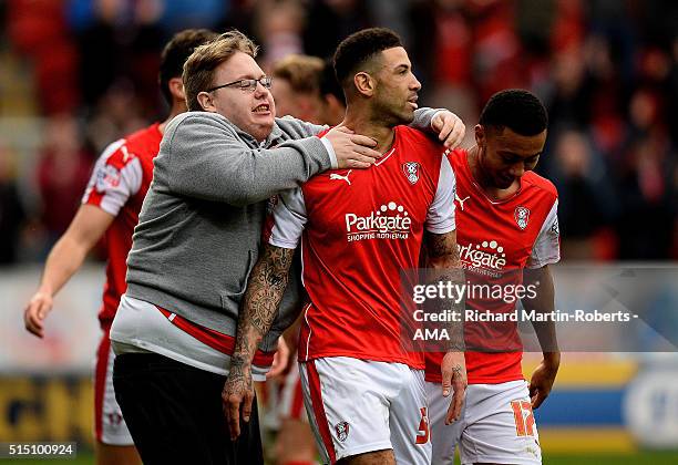 Supporter runs on to the pitch to celebrate with Leon Best of Rotherham United after he scored his team's third goal to make the score 3-3 during the...