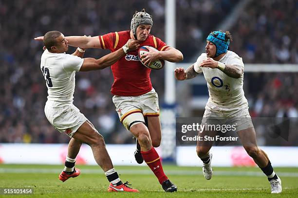 Jonathan Davies of Wales is tackled by Jonathan Joseph and Jack Nowell of England during the RBS Six Nations match between England and Wales at...