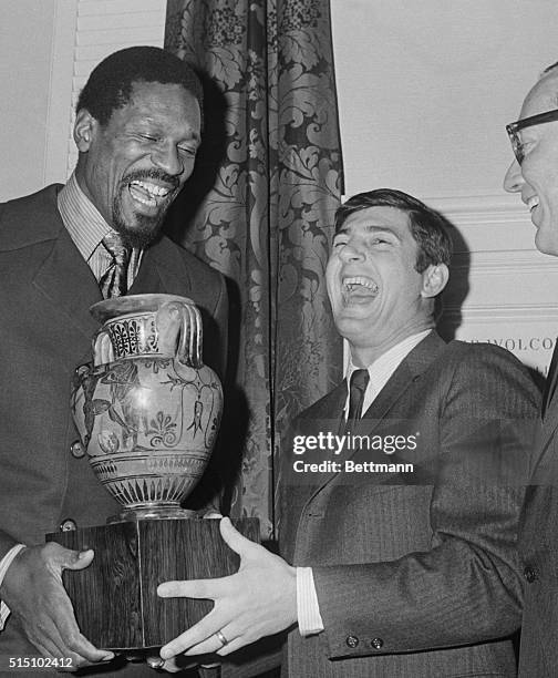 Boston: Celtics player-coach Bill Russell enjoys a hearty laugh with Red Sox star Carl Yastrzemski at the Harvard Club after he was presented a...