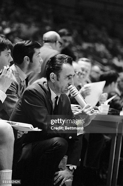 Boston College basketball coach Bob Cousy appears to be in a pensive mood as he watches his team defeat Kansas, 78-62, in the first round of the...