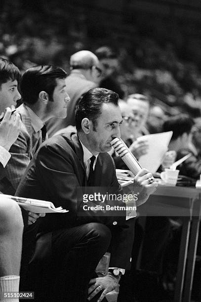 Boston College basketball coach Bob Cousy appears to be in a pensive mood as he watches his team defeat Kansas, 78-62, in the first round of the...