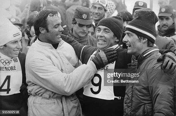 Austrian skier Karl Schranz being congratulated by teammate Toni Sailer and Frenchman Jean-Claude Killy after winning the Olympic slalom event here....