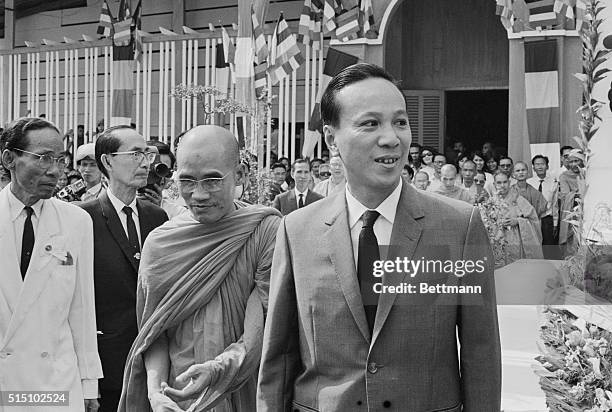 Saigon, South Vietnam: Nguyen Van Thieu, South Vietnam president is shown with Thich Tam Chau at Requiem Mass for National Prayer Day.