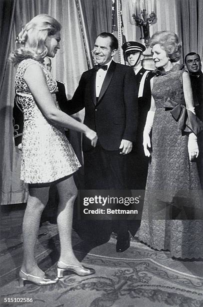 Washington, DC: Mrs. Joan Kennedy, wife of Senator Edward Kennedy , is welcomed by President and Mrs. Nixon to the second of three receptions for...