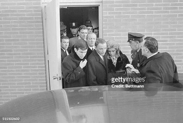 Attend Wake. Cliffside Park, New Jersey: A subdued Frank Sinatra, flanked by his son, Frank Jr. And daughter Nancy, leaves Macagna Funeral Home here...