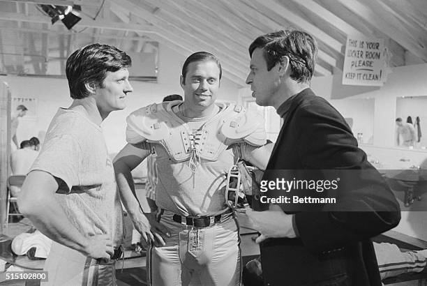 Author George Plimpton confers with Alan Alda on the set of the 1968 comedy Paper Lion, a film adaptation of Plimpton's best-selling book. Alda plays...