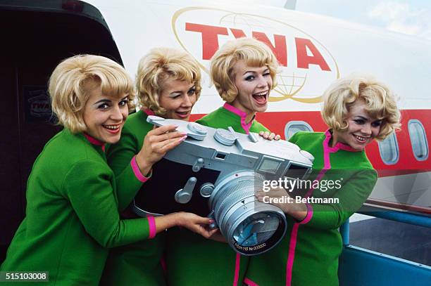 The Jacob Sisters by a TWA Plane with a Leica camera.