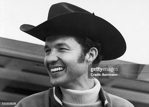 Richard Petty, NASCAR's winningest stock car driver doesn't give the impression of being one of the Ford "bad boys" as he poses in his black hat...