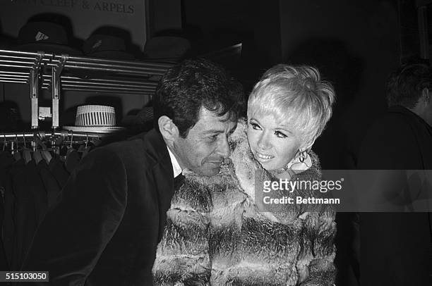 Singer Eddie Fisher and his wife, singer and actress Connie Stevens, at the premiere of Paramount Pictures' Half a Sixpence.