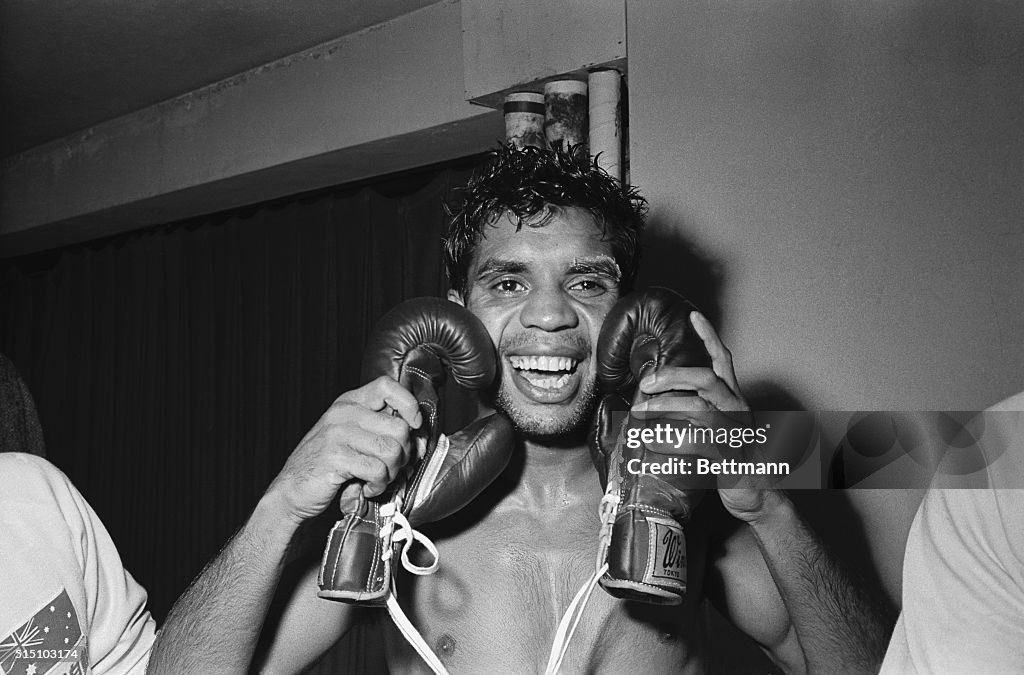 Lionel Rose Embracing his Boxing Gloves