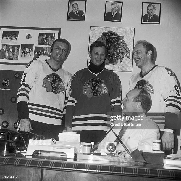 Chicago Black Hawks coach Billy Reay , huddles with a trio of Hawks prior to workout on Chicago Stadium ice 3/31. Left to right, standing: Doug Mohns...