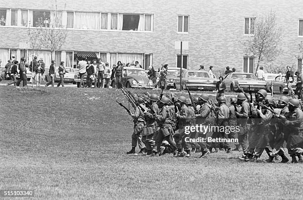 National Guardsmen are seen here on May 4th moving across the common on the Kent State campus, where four anti-war protesters were shot and killed...