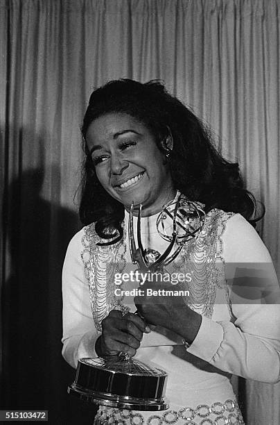 Actress Gail Fisher holding the Best Supporting Actress in a series Emmy she won for the series "Mannix".