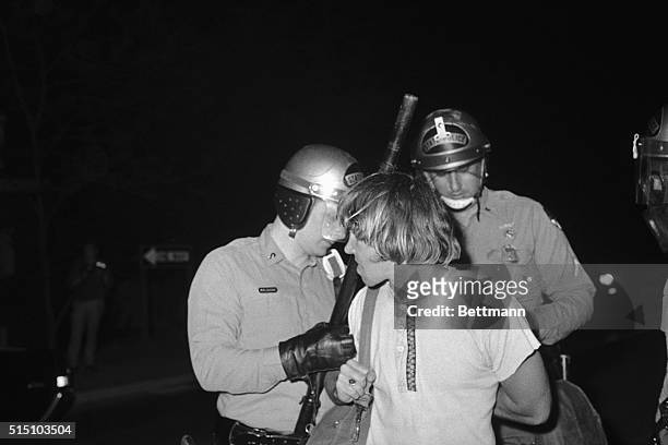 Student Outrage. College Park, Maryland: A student protester stands with his wrists bound in handcuffs during a riotous anti-war demonstration, May...