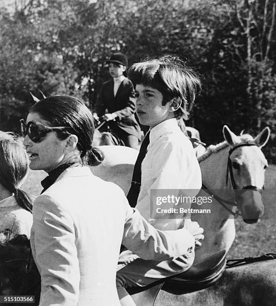 Mrs. Jacqueline Onassis appears somewhat apprehensive as she and her son, John F. Kennedy, Jr., await results of his performance during competition...