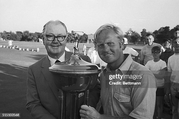 Jack Nicklaus receives the winners trophy from Byron Nelson after Nicklaus defeated Arnold Palmer on the first hole of sudden death playoff to take...