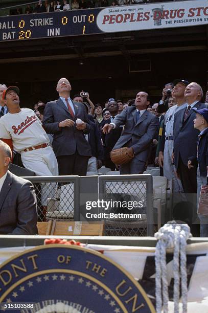 After having dropped the first ball, President Richard Nixon throws out a second and third ball to open the 1969 baseball season at the newly-named...
