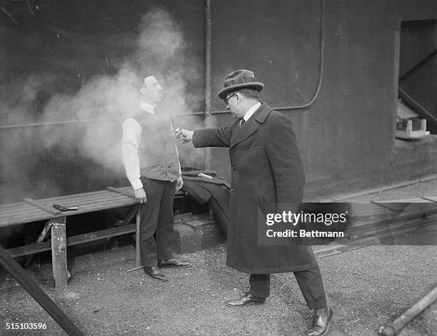 Demonstration on Palace Roof, 57th Street and 7th Avenue, showing the shellproof steel jacket. Leo Krause wearing the jacket, which weighs 12 pounds....