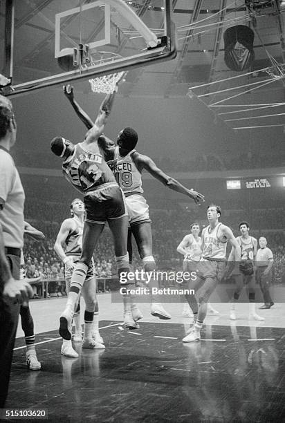 New York: Lakers Wilt Chamberlain and Knicks' Willis Reed vie for the rebound shortly before Reed was injured in first period of NBA final playoff...