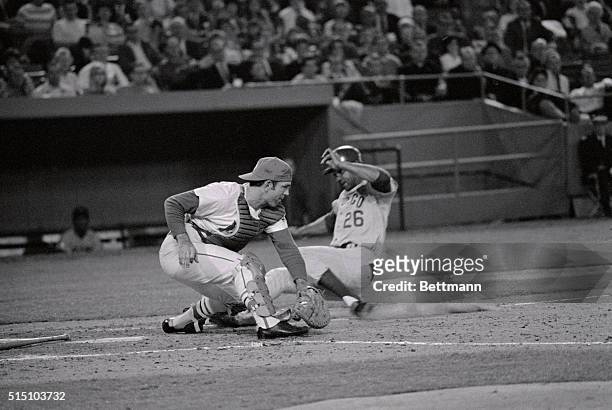 Chicago Cubs' Billy Williams scores as St. Louis Cardinals' catcher Tim McCarver takes the throw from 3rd baseman Mike Shannon in the third inning of...