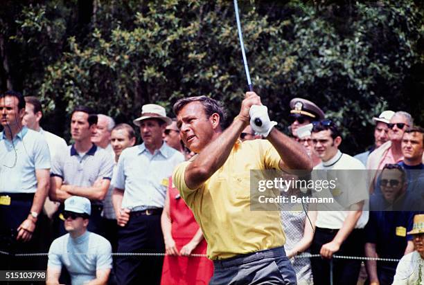 Augusta, GA- ORIGINAL CAPTION READS: Arnold Palmer bogies the hole during the second day of the Masters Golf Tournament.