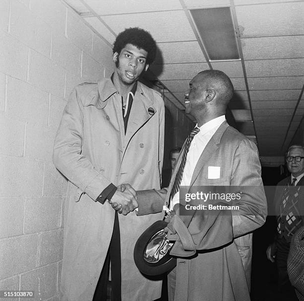 New York, NY- Unanimous choice for the NBA Rookie of the Year Lew Alcindor is congratulated by his father, Lew Alcindor Sr. Honored by sports writers...