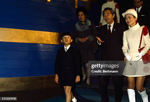 Prince Hiro, grandson of Emperor Hirohito, is shown with the Emperor and other unidentified people, as they tour EXPO '70 in Osaka, Japan.