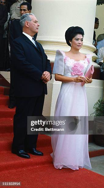 Imelda Marcos is shown with Minister Keith Holyoake of New Zealand prior to the formal opening of the summit at the Philippine Congress.