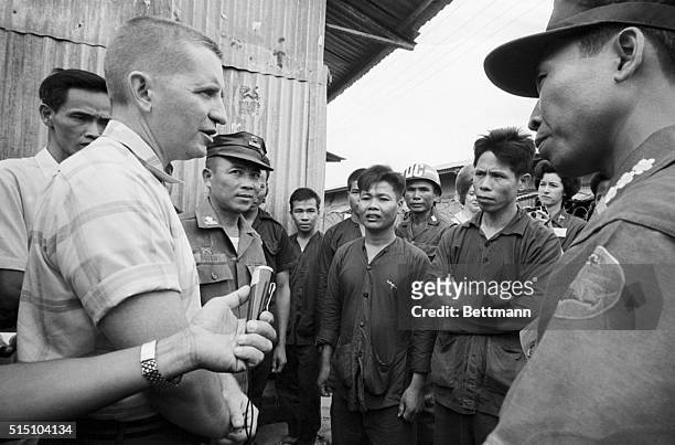 Da Nang, Vietnam- Speaking through an interpreter, millionaire H. Ross Perot talks with North Vietnamese prisoners of war at a South Vietnamese POW...