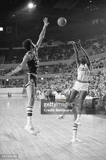 Buffalo, NY- Kareem Abdul-Jabbar, of the Milwaukee Bucks, extends his body to block a shot in game here, Feb. 16th against the Buffalo Braves.