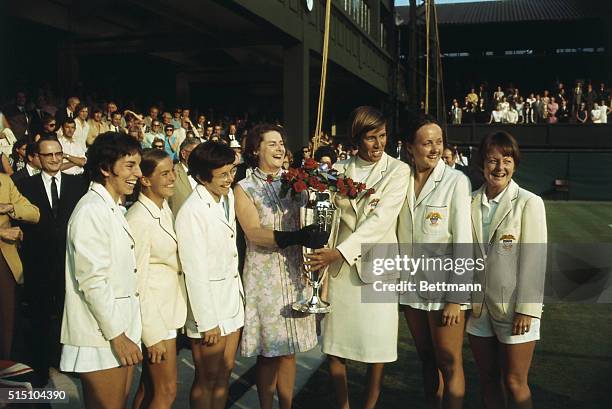 American Wightman Cup team members with the trophy they won after their match with the British team at Wimbledon. Left to right: Julie Heldman, Nancy...