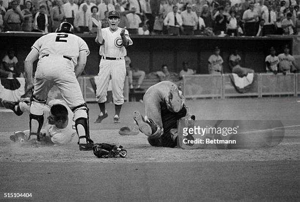 All Star Game- Cleveland Indians catcher Ray Fosse lies on the ground after his 12th inning collision with Cincinnati Reds Pete Rose, No.14. Rushing...