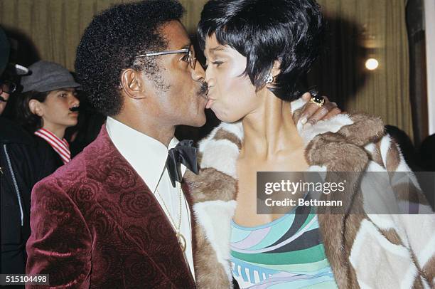Hollywood, California: Entertainer Sammy Davis Jr. And his wife, attend a movie premiere of Dr. Phibes at Pacific's Pantages Theater.