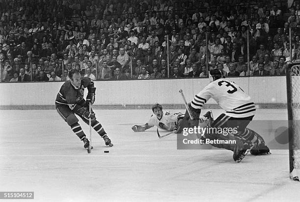 Montreal's veteran Henri Richard cracks a drive past Chicago Black Hawks' goalie Tony Esposito in the third period of seventh Stanley Cup game here...