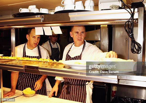 Gary Rhodes prepares the food for the opening of his Restaurant "24" on the twenty fourth floor of the Old Nat West Building on October 17, 2003 in...