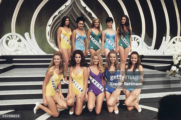 The ten Miss Universe contestants are shown here as they pose in bathing suits for a group photo.