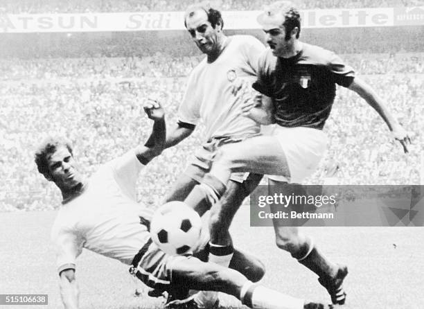 Italian forward Alessandro Mazzola takes it up with Brazilians Brito and Gerson during World Cup final here today 6/21 at the Azteca Stadium.