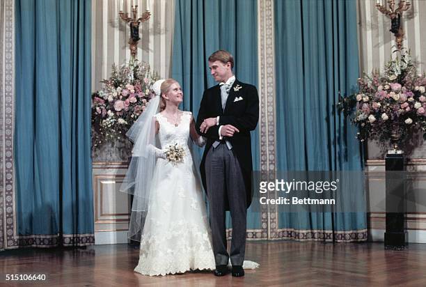 Washington, DC.: Mr. And Mrs. Edward Finch Cox pose for a formal photograph in the White House following their wedding in the White House rose...