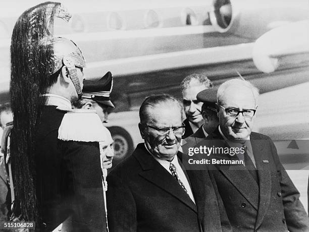 President Tito of Yugoslavia is escorted by Italian president Giuseppe Saragat as they walk past a corazziere upon Tito's arrival in Rome March 25th...