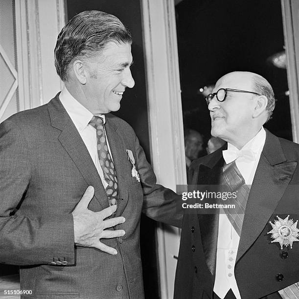 Smiling and chatting happily in a leading Paris Hotel here Marcel Dassault President Director General of Avions Marcel Dassault after he pined Najeeb...