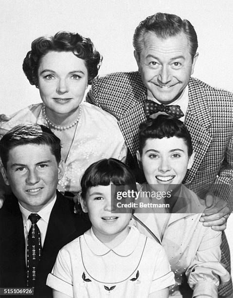 Robert Young and Jane Wyatt with the TV family from the show "Father Knows Best." The children are, left to right: Billy Gray, Lauren Chapin, and...