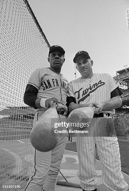 Two of baseball's top ten all time home run hitters, San Francisco's Willie Mays, and Minnesota's Harmon Killebrew, check their respective bats prior...