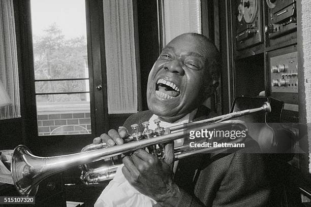 New York, New York: Satchmo's Back. Louis "Satchmo" Armstrong gives his great big famous grin back home in Queens, New York after 10 weeks of...